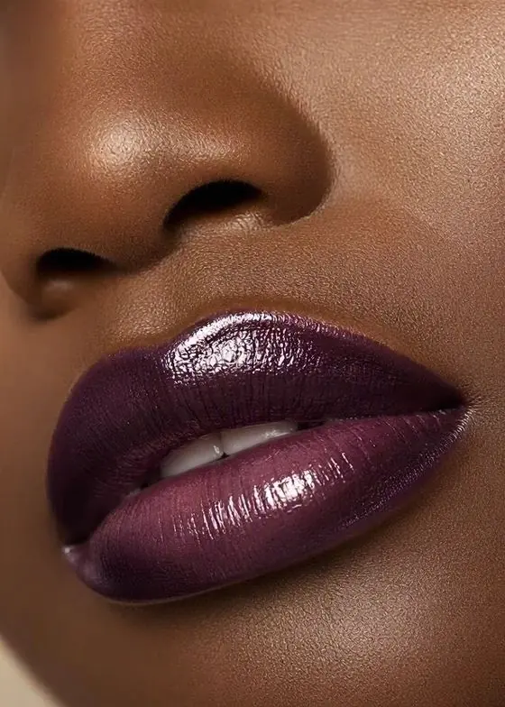 Velvet plum glossy lip close-up